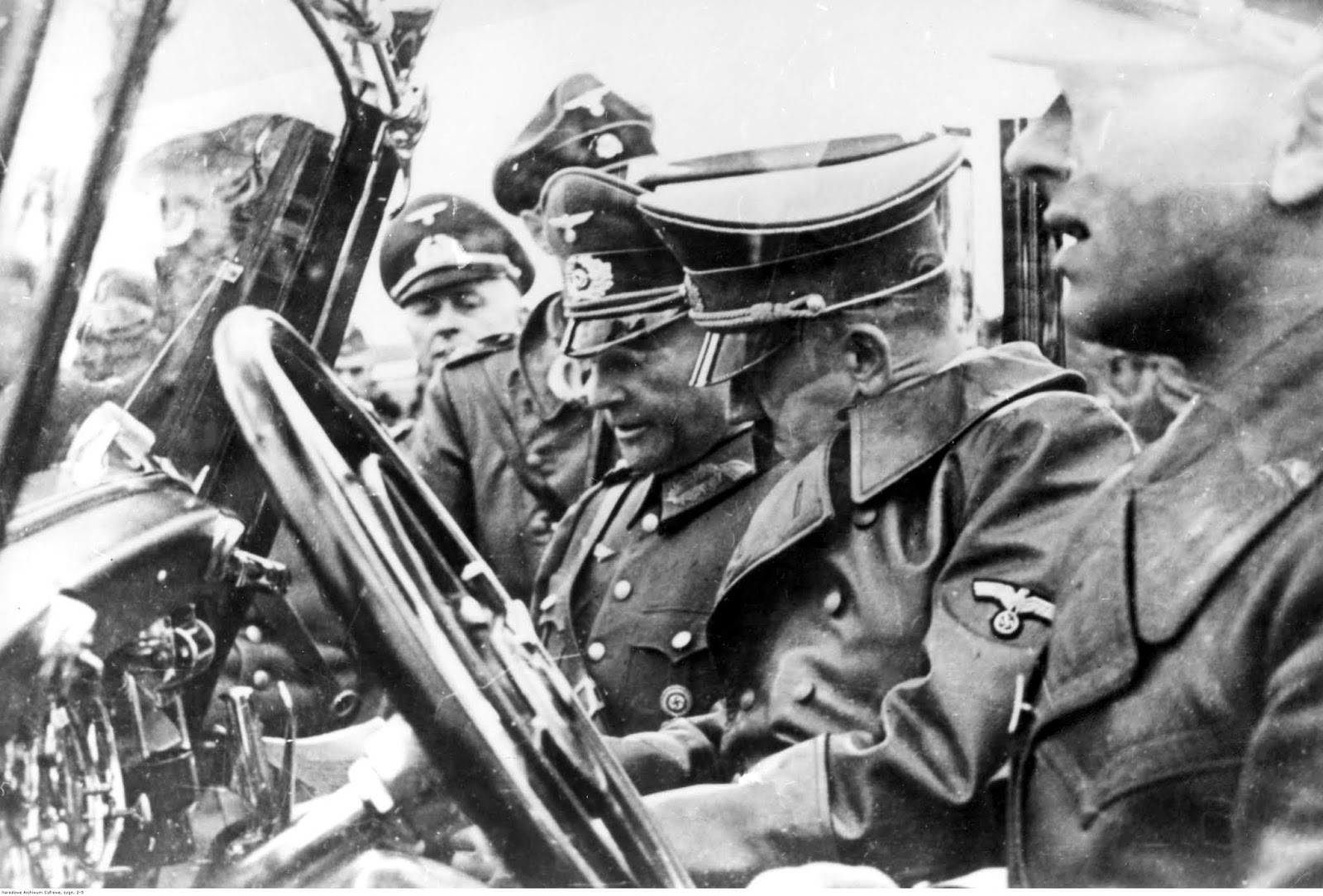 Adolf Hitler during a visit to Kriegsmarine base in Wilhelmshaven with Walther von Brauchitsch and his chauffeur Erich Kempka